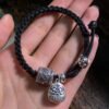 Pulsera Tibetana Negra con Charmes de Cobre-1